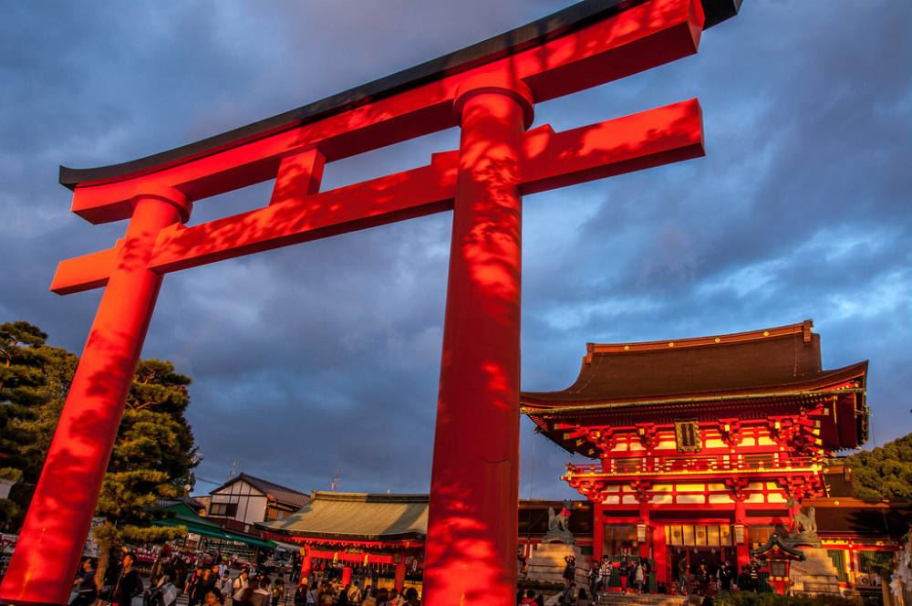 The brightly colored torii gate of Fushimi Inari Shrine